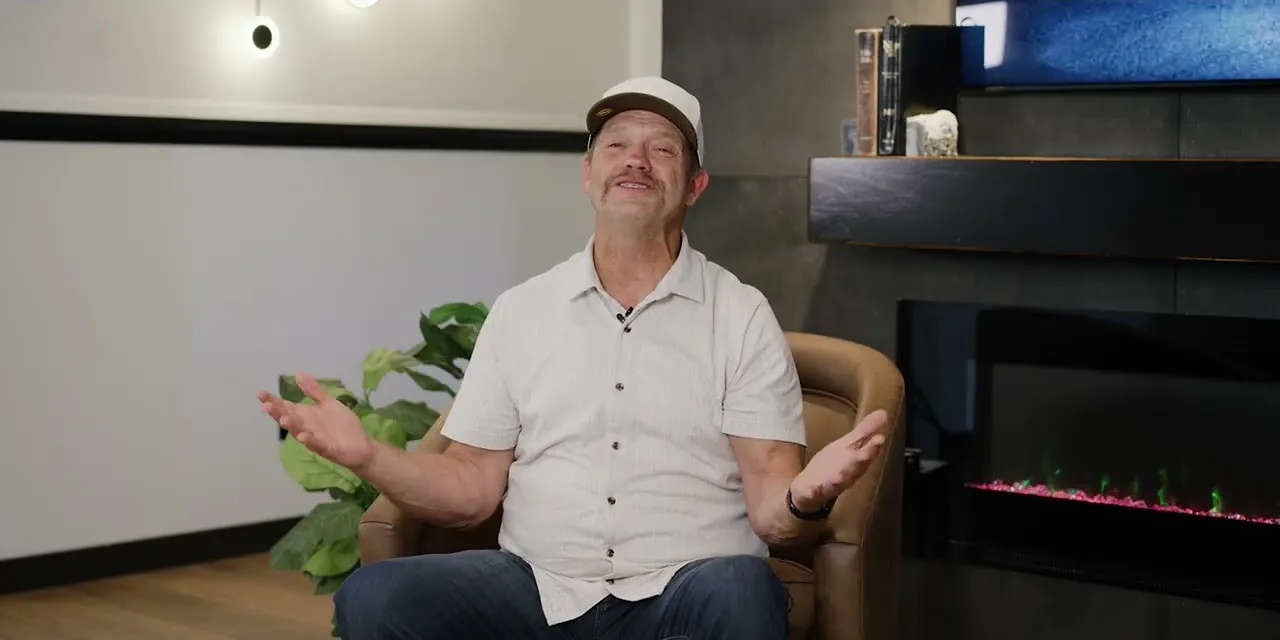 James Bergstrom seated in his studio, explaining what each price tier buys in Kitsap County